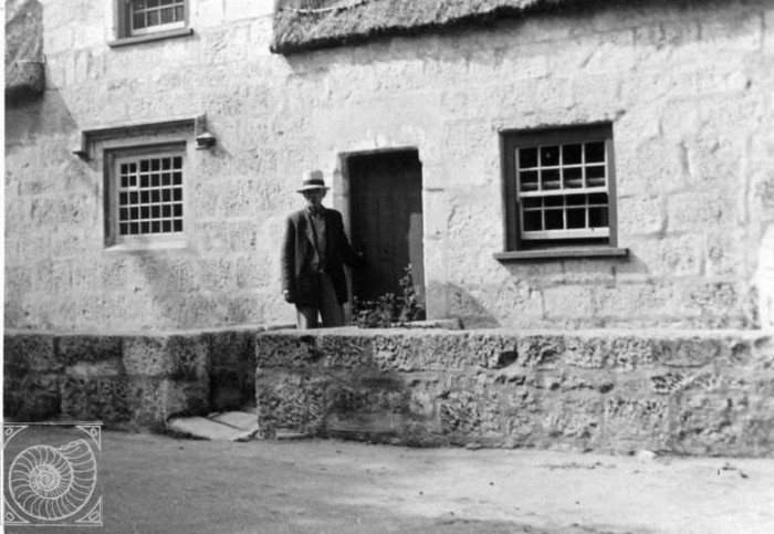 Old photo of a man outside the museum
