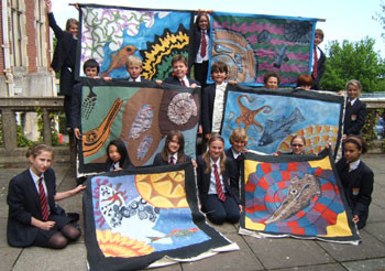 Children outside with quilts